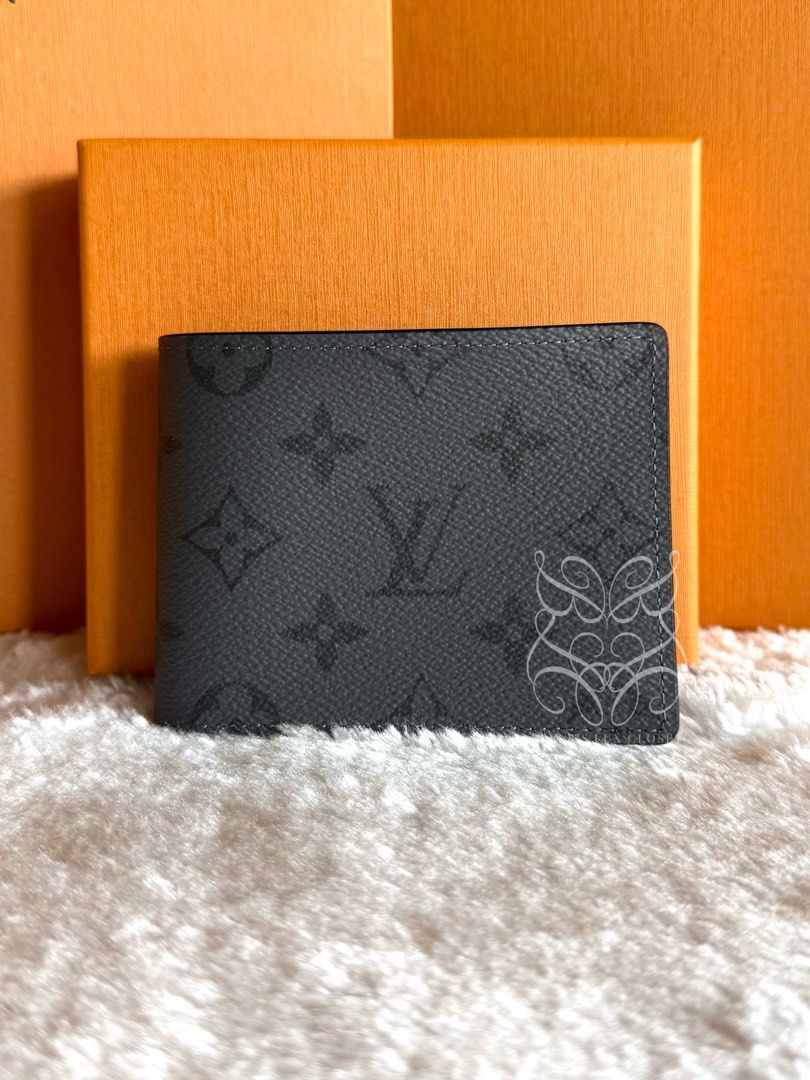 Louis Vuitton Multiple Wallet in Reverse Monogram Eclipse Canvas (Category: Luxury Bags & Wallets) located in Paranaque City. Submitted by belles_lux_closet (Listing ID 1458344672, Image 2). Description: AUTHENTIC MULTIPLE WALLET IN REVERSE MONOGRAM ECLIPSE CANVAS (Microchipped, Like New & Full Set) ✅ 100% Guaranteed Authentic ✅ Mint Condition, Rank A-SA ✅ Microchipped ✅ Comes with dust bag, box, and authenticity certificate! ✅ Legit seller ✅ Ava