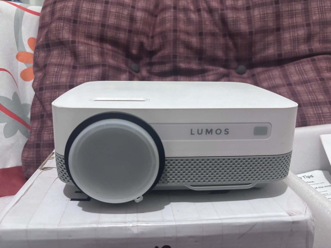 Lumos Dawn Smart Projector (Category: Projectors) located in Manila. Submitted by youngocean_c6829a (Listing ID 1458487122, Image 3). Description: The Lumos Dawn Smart Projector: It features built-in apps like Netflix and YouTube, an Android OS with 1GB RAM and 8GB ROM, 2,500 lumens brightness, and a native 600p resolution with 1080p support for screen sizes up to 150 inches. Key Features ✅ Smart OS: Built-in Android system with pre-installed app