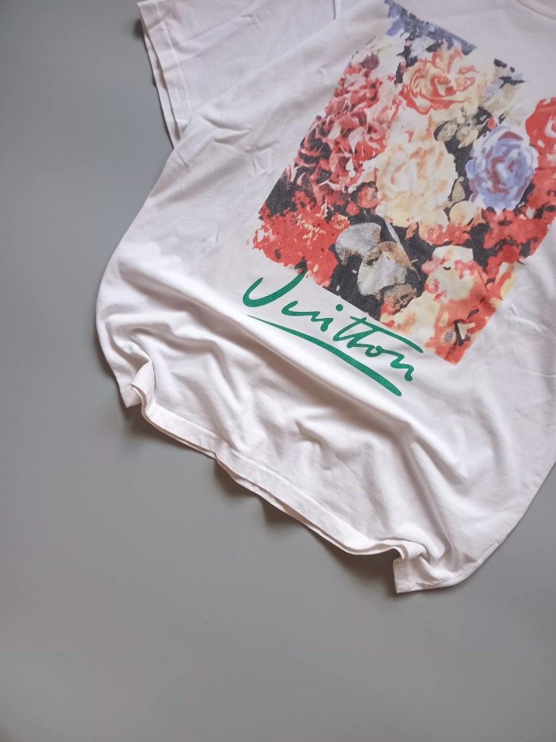 lv laser print graphic tee (Category: Tshirts & Polo Shirts ) located in San Isidro. Submitted by lagloots (Listing ID 1458384436, Image 3). Description: lv graphic tee laser print hindi kasama yung mga green sa issue na part (cam probs) fits large DIMES (IN INCHES) LENGTH: 29 / WIDTH: 22 CONDITION: 9/10 [] COLOR RATE: 9/10 ISSUE: minimal stains, small cut (not pinhole).