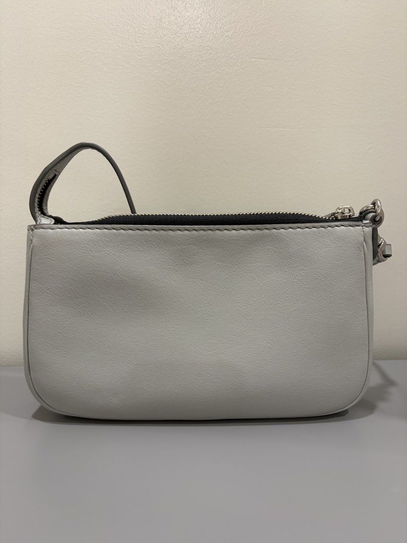 Marc Jacobs Grey Leather Mini shoulder Bag (Category: Luxury Bags & Wallets) located in Ligao. Submitted by twixiedoodle (Listing ID 1458346808, Image 2). Description: - Genuine Marc Jacobs grey leather mini bag - Secure zip closure - Interior slip pocket for organization - Unique repeating logo pattern lining - Detachable strap for versatile wear - Ideal size for carrying essentials.