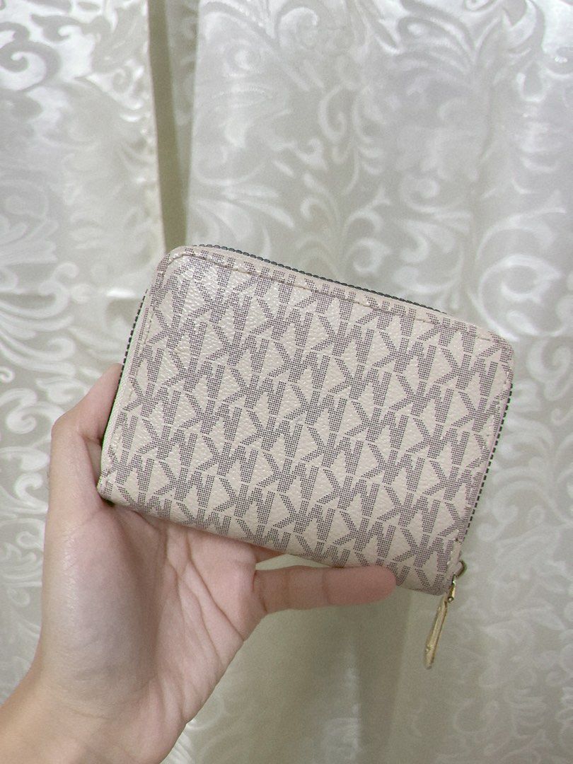 Michael Kors MK Cream Monogram Wallet (Category: Wallets & Card holders) located in Dagupan City. Submitted by _jxllyz (Listing ID 1458440434, Image 2). Description: Condition: 9/10 High quality only •Clean interior and exterior, no marks or stains •Has zipper closure on the outside, with 4 card slots and small coin compartment at the center.