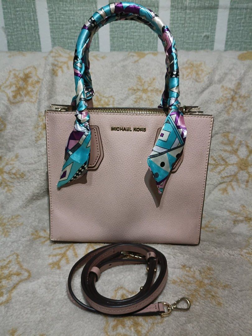 Auth Michael Kors Mercer Bag (Category: Luxury Bags & Wallets) located in Manila. Submitted by handpickedbycox (Listing ID 1458411985, Image 1). Description: 📌Auth Michael Kors Mercer bag - Soft pink pebbled leather - Detachable shoulder strap included - Handles adorned with a colorful silk scarf - Gold-tone hardware - Secure zipper closure - Ideal for everyday carry ❌WITH SIGNS OF USED ❌BAWAL SA MAARTE ❌NO COD NO COP.