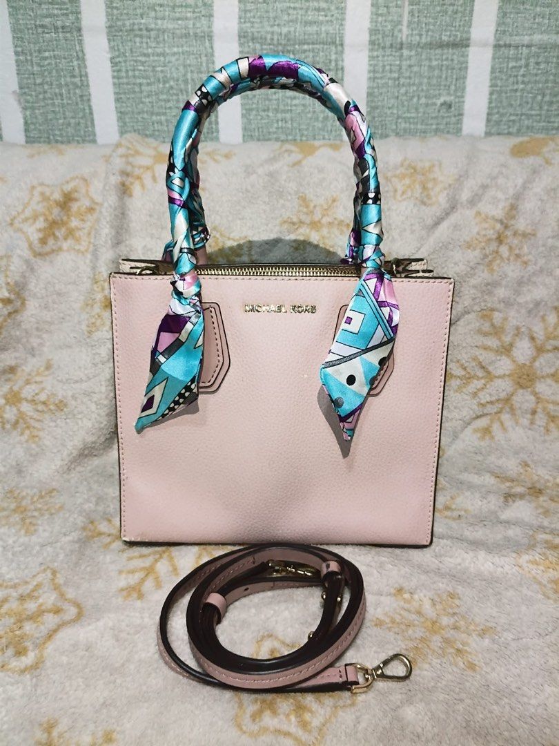 Auth Michael Kors Mercer Bag (Category: Luxury Bags & Wallets) located in Manila. Submitted by handpickedbycox (Listing ID 1458411985, Image 2). Description: 📌Auth Michael Kors Mercer bag - Soft pink pebbled leather - Detachable shoulder strap included - Handles adorned with a colorful silk scarf - Gold-tone hardware - Secure zipper closure - Ideal for everyday carry ❌WITH SIGNS OF USED ❌BAWAL SA MAARTE ❌NO COD NO COP.