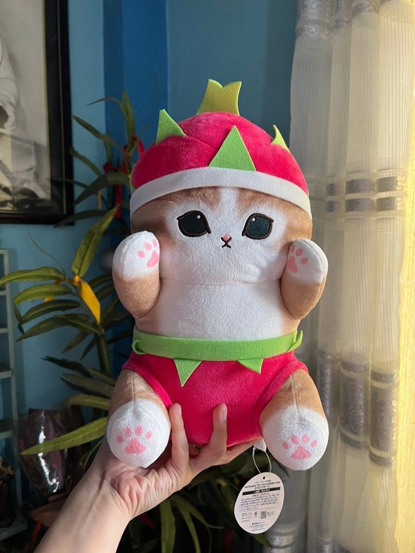 Mofusand Dragon Fruit Plush Toy (Category: Plushies & Soft Toys) located in Mandaluyong City. Submitted by fluffycollections.ph (Listing ID 1458462615, Image 1). Description: - Adorable cat plushie dressed as a dragon fruit - Super soft and huggable material - Perfect for collectors or as a thoughtful gift - Comes with original tags attached .