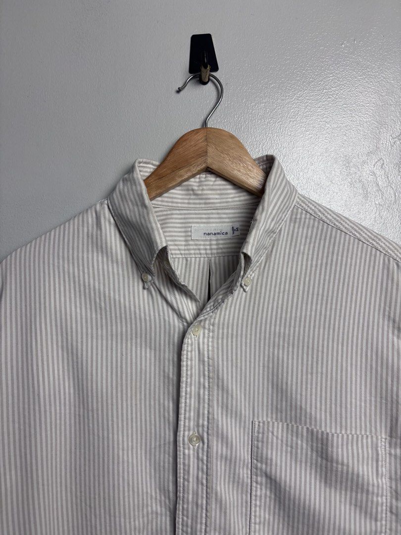 Nanamica Button Down Wind Shirt. (Category: Luxury Apparel) located in Bacoor. Submitted by jewa333 (Listing ID 1458375233, Image 3). Description: Nanamica Stripe Button Down Wind Shirt Made in Japan 🇯🇵 Medium on tag. Dimes: Length front 30” Back 31” Width 24” Shoulder 18” Sleeves 24.75” Excellent condition Issue: None. 🏷️1,500 only. 📥📥📥.