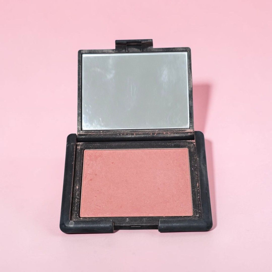 NARS Deep Throat Blush (Category: Makeup) located in Taguig. Submitted by altainfante (Listing ID 1458357376, Image 1). Description: - NARS Blush in shade 'Deep Throat', full size - Classic peachy pink shade - Significant amount of product remaining - Features a compact with a mirror - Perfect for achieving a natural-looking flush - Reason for selling: Not reaching for it often.
