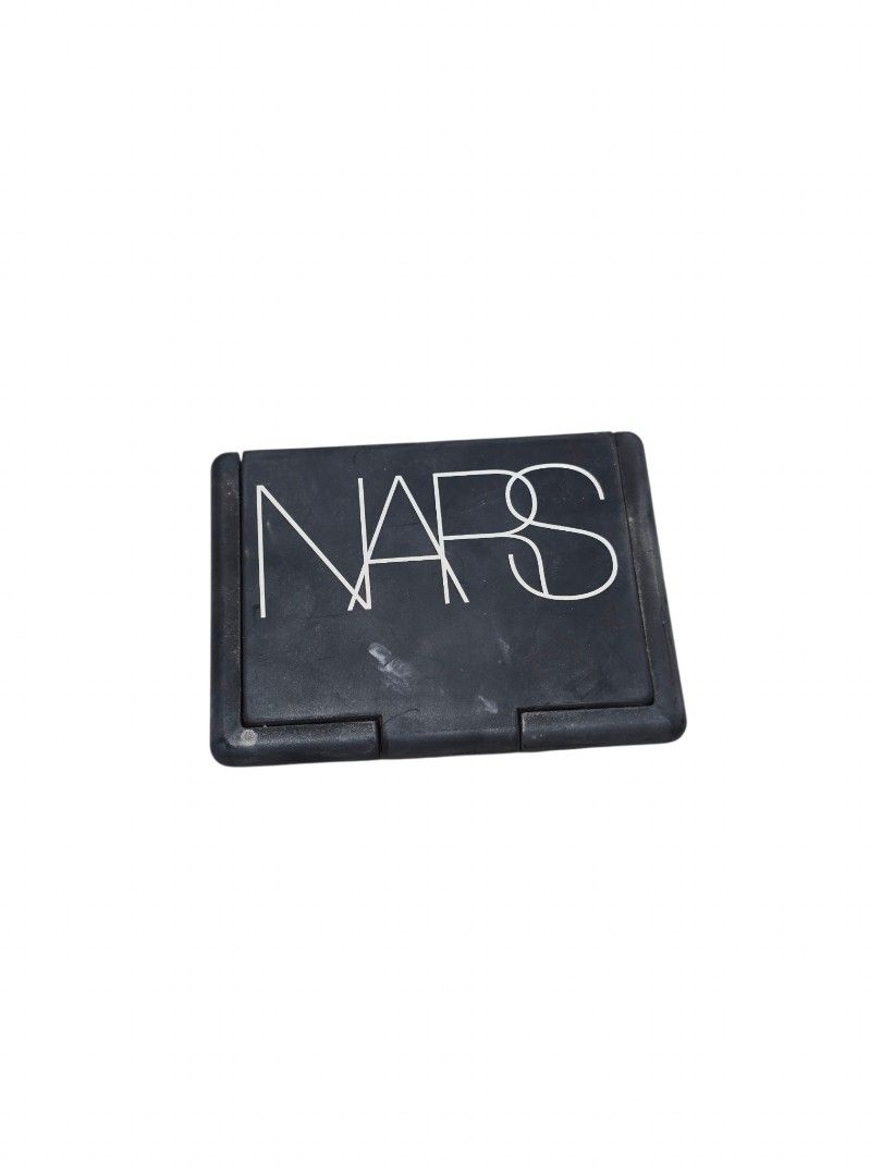 NARS Deep Throat Blush (Category: Makeup) located in Taguig. Submitted by altainfante (Listing ID 1458357376, Image 3). Description: - NARS Blush in shade 'Deep Throat', full size - Classic peachy pink shade - Significant amount of product remaining - Features a compact with a mirror - Perfect for achieving a natural-looking flush - Reason for selling: Not reaching for it often.
