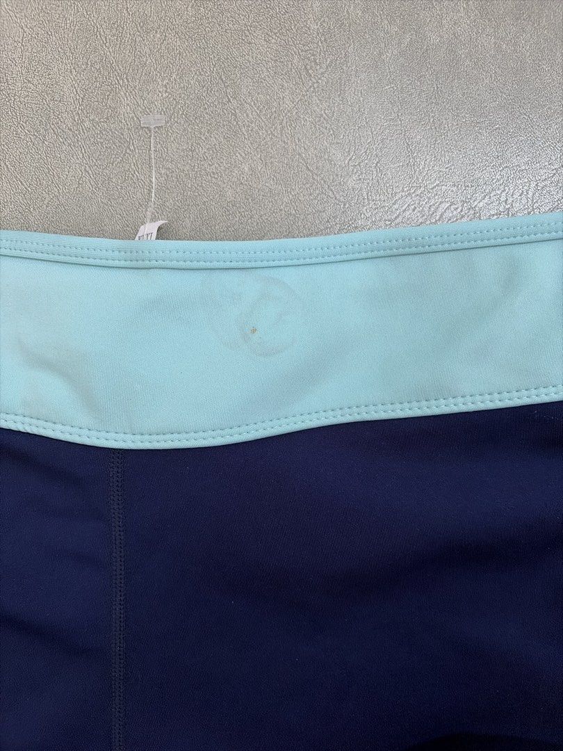 Navy Blue Athletic Shorts with Light Blue Trim (Category: Shorts) located in Bulacan. Submitted by aarchive (Listing ID 1458307784, Image 3). Description: - Navy blue athletic shorts - Light blue trim on sides and waistband - Drawstring closure - Size XXXL - Small stain on waistband (visible in last photo) - Perfect for workouts or lounging or swimming.