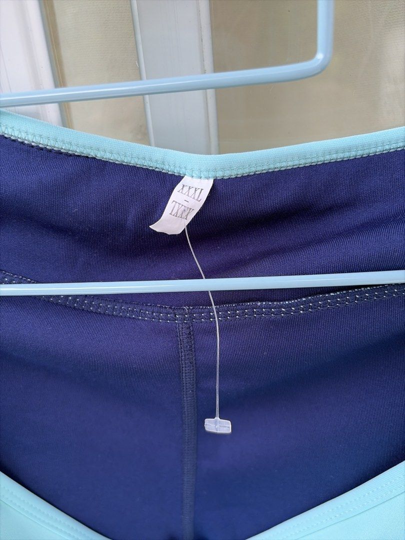 Navy Blue Athletic Shorts with Light Blue Trim (Category: Shorts) located in Bulacan. Submitted by aarchive (Listing ID 1458307784, Image 2). Description: - Navy blue athletic shorts - Light blue trim on sides and waistband - Drawstring closure - Size XXXL - Small stain on waistband (visible in last photo) - Perfect for workouts or lounging or swimming.