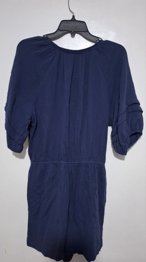 Navy Blue Gauze Romper with Tassel Drawstrings (Category: Rompers) located in Muntinlupa City. Submitted by iaramos (Listing ID 1458355586, Image 2). Description: - Navy blue gauze romper - Short sleeves with ruffled detail - Elasticated waist with adjustable drawstring - Tassel details on neckline drawstring - Button-up front - Comfortable and breezy for warm weather - Ideal for casual outings.