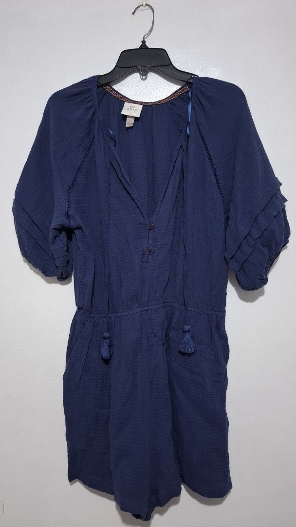 Navy Blue Gauze Romper with Tassel Drawstrings (Category: Rompers) located in Muntinlupa City. Submitted by iaramos (Listing ID 1458355586, Image 1). Description: - Navy blue gauze romper - Short sleeves with ruffled detail - Elasticated waist with adjustable drawstring - Tassel details on neckline drawstring - Button-up front - Comfortable and breezy for warm weather - Ideal for casual outings.