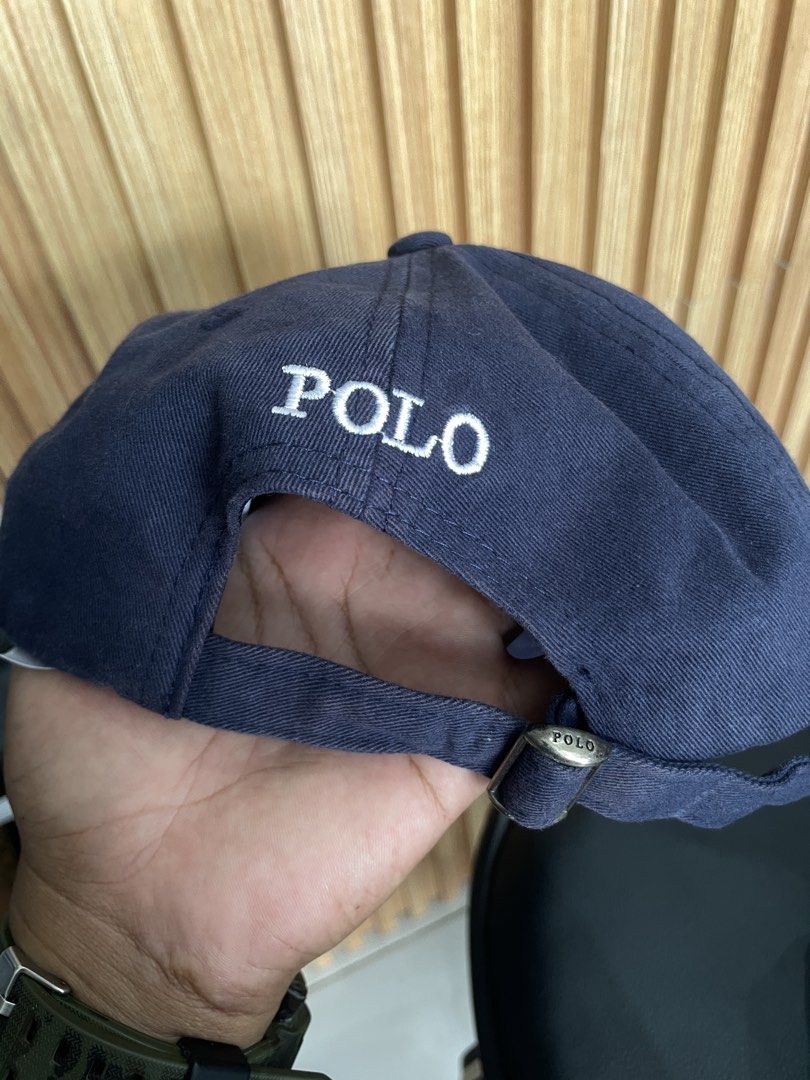 Navy Polo Ralph Lauren Cap (Category: Caps & Hats) located in Manila. Submitted by kyleee_ld (Listing ID 1458391360, Image 2). Description: - Classic navy blue cap from Polo Ralph Lauren. - Features iconic embroidered polo player logo on the front. - 'POLO' embroidered on the back. - Adjustable strap for a comfortable fit. - One size fits most. - Made in Cambodia..