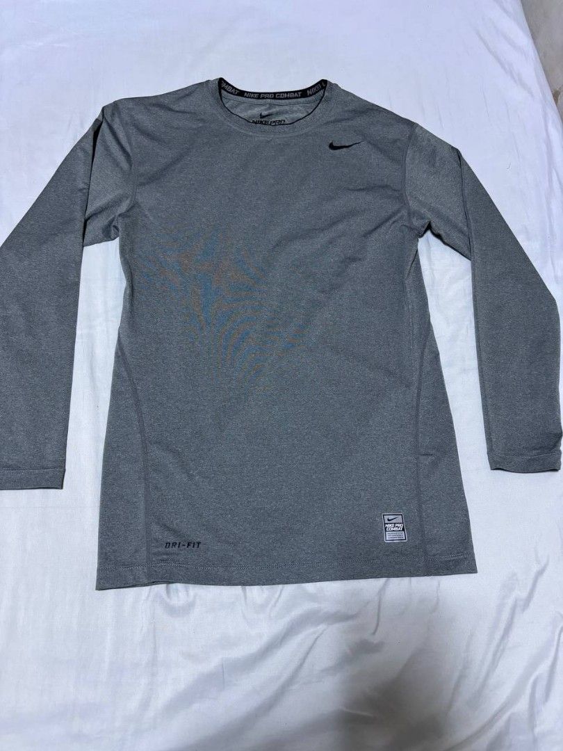 Nike Compression Pro Combat Dri-FIT Grey Long Sleeve Shirt (Category: Activewear) located in Pasig City. Submitted by heneralsupremo1892 (Listing ID 1458455540, Image 1). Description: - Grey Nike Pro Combat long sleeve shirt - Dri-FIT material to keep you dry - Ideal for workouts or as a base layer - Authentic and Legit❗ - Very Good Condition/ Almost New 🔥 - Size: L to XL 🫶 - No issue/Color may vary due to lighting🙂 THANK YOU, GOD BLESS 🙏😊.