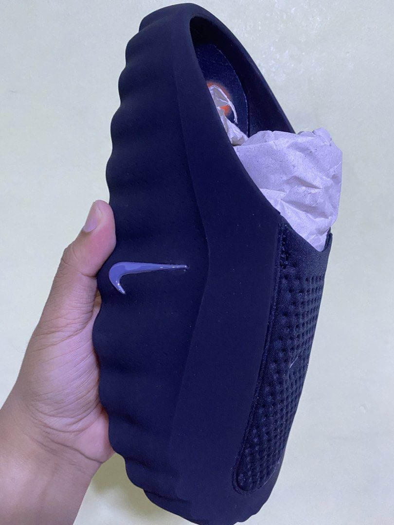 Nike Mind 001 Black Slip-On Sandals (Category: Slippers & Slides) located in Manila. Submitted by mcclaire214625 (Listing ID 1458457382, Image 2). Description: - Black Nike Mind 001 sandals - Easy slip-on style - Perforated top for enhanced breathability - Features distinctive orange sole details - Comes with original tag - Ideal for everyday casual wear.