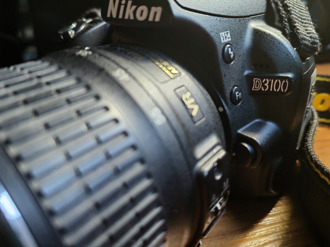 Nikon D3100 DSLR Camera with Lens (Category: Cameras) located in Quezon City. Submitted by abeharvestmoon27 (Listing ID 1458357113, Image 3). Description: - Nikon D3100 DSLR camera - Ideal for beginner photographers - Includes kit lens - Low shutter count - personal use only, still fresh - Still in good working condition - Comes with Nikon strap and lens cap - Includes a camera bag, wall charger, rubber lens cap, external mic, flash cables etc.. 