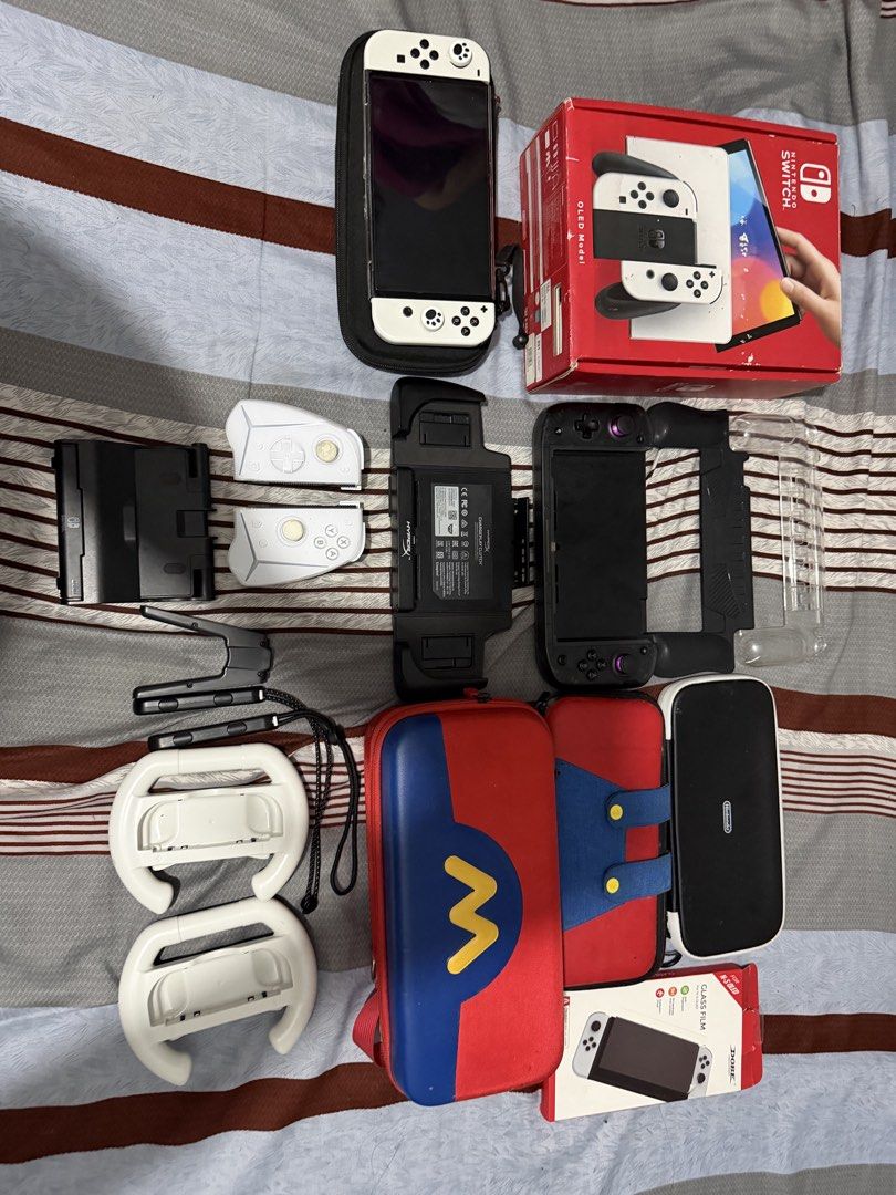 Nintendo Switch OLED JB 1TB (Category: Nintendo) located in Caloocan City. Submitted by joy144 (Listing ID 1458312591, Image 1). Description: Switch Oled Jb 1TB - complete accessories with box - with 100+ games - 2 extra hardcase - extra tempered glass - Nitro deck plus - Easy Smx Controller - 4 extra Storage Bag - hyperX dock accessories - extra charger nintendo dock - Extra joycon strap - Joycon Wheel .