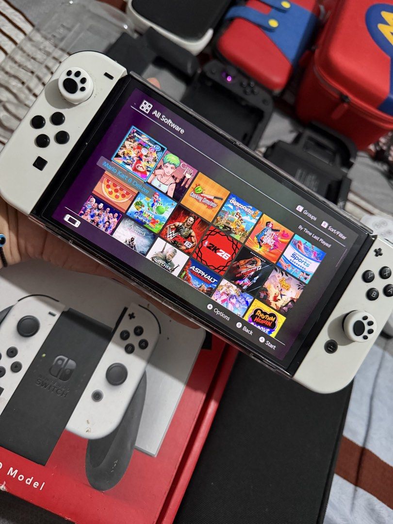 Nintendo Switch OLED JB 1TB (Category: Nintendo) located in Caloocan City. Submitted by joy144 (Listing ID 1458312591, Image 2). Description: Switch Oled Jb 1TB - complete accessories with box - with 100+ games - 2 extra hardcase - extra tempered glass - Nitro deck plus - Easy Smx Controller - 4 extra Storage Bag - hyperX dock accessories - extra charger nintendo dock - Extra joycon strap - Joycon Wheel .