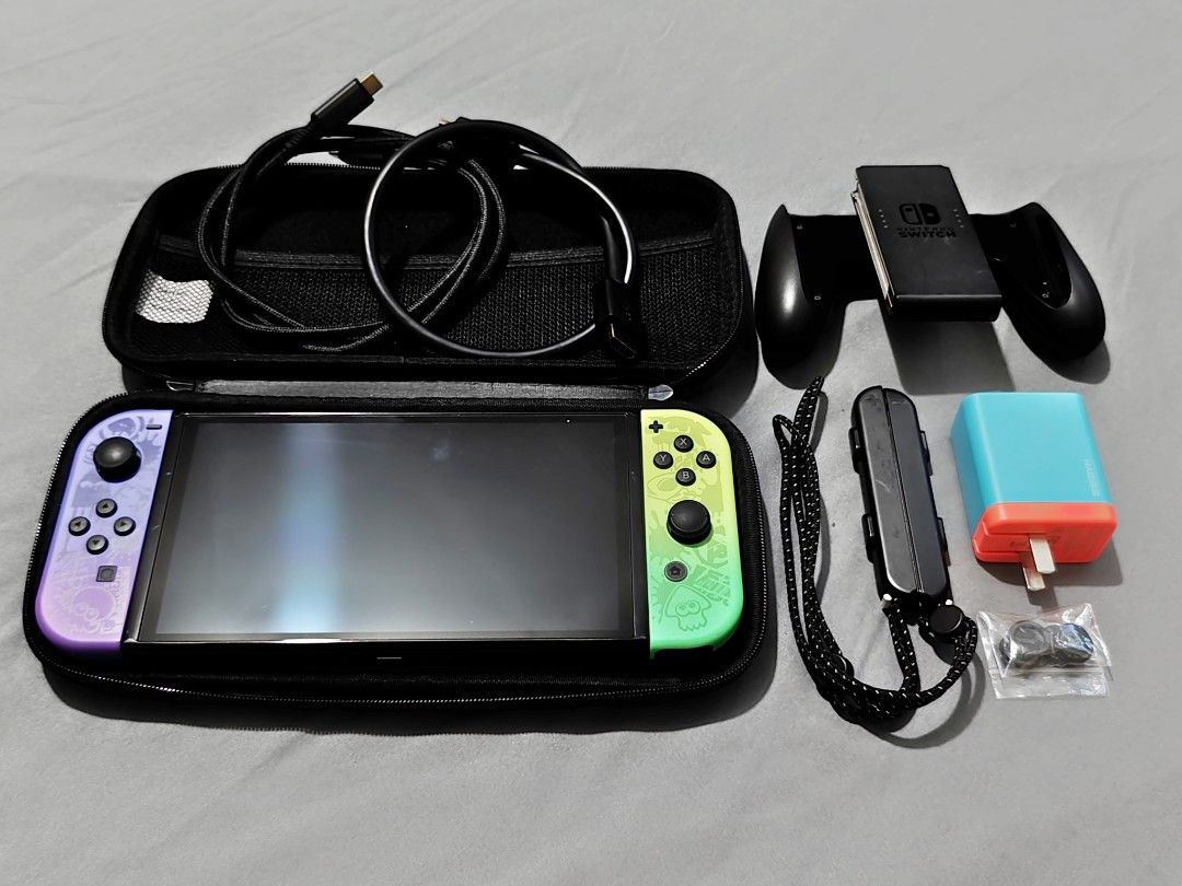 Nintendo Switch OLED (Splatoon Edition) (Category: Nintendo) located in Manila. Submitted by tutuy256 (Listing ID 1458408268, Image 1). Description: "READ DESCRIPTION" Nintendo Switch OLED (Splatoon Edition) Selling Price - P10,000 Great Condition (98% Smooth) (NO HISTORY OF REPAIR) Inclusion - Unit (Splatoon 3 Edition) - L/R Joy-Con (Splatoon 3 Edition) - L/R Joy-Con Straps - Joy-Con Grip - Replacement Charger/Portable Dock (Ugreen) - Replacemen