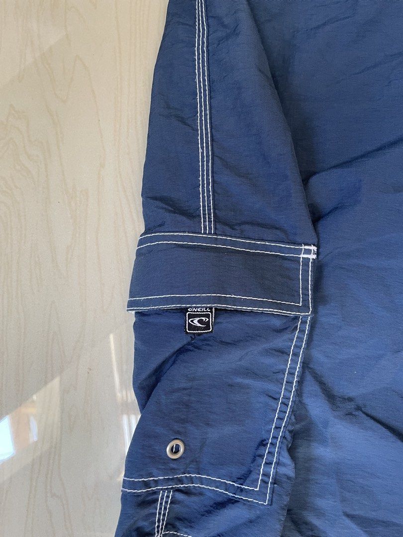 O'Neill Navy Blue Cargo Swim Trunks (Category: Swim Trunks & Board Shorts) located in Zamboanga. Submitted by guthens (Listing ID 1458407060, Image 3). Description: Waistline- 36.4x23.4 open leg- 13.4 Condition- excellent Issue- none Color rate- 9.7/10 .