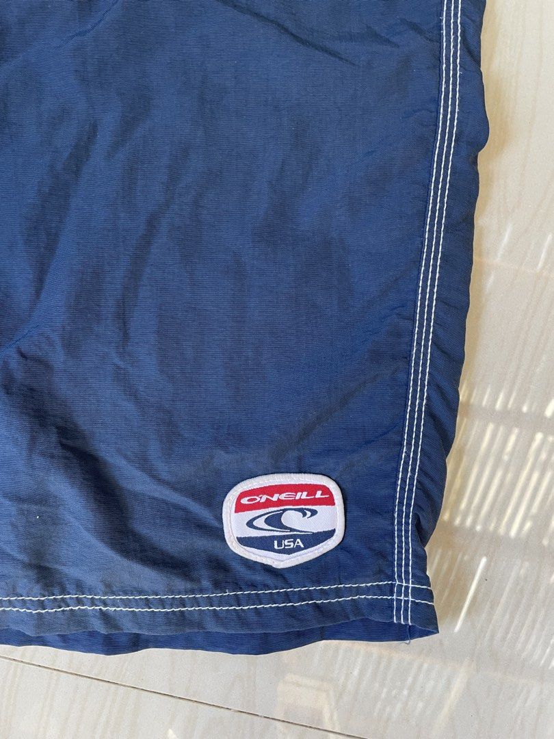 O'Neill Navy Blue Cargo Swim Trunks (Category: Swim Trunks & Board Shorts) located in Zamboanga. Submitted by guthens (Listing ID 1458407060, Image 2). Description: Waistline- 36.4x23.4 open leg- 13.4 Condition- excellent Issue- none Color rate- 9.7/10 .