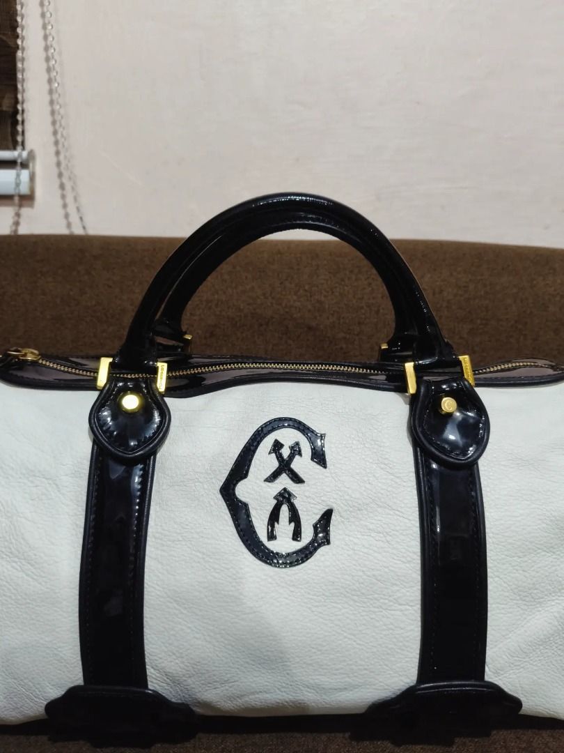Original CHARIOL (Category: Luxury Bags & Wallets) located in Cabuyao City. Submitted by your____lux____shop (Listing ID 1458468152, Image 2). Description: Sale❗️Sale❗️Sale❗️ ₱ 5,880 Original CHARRIOL Almost new Black & white Ykk zipper Medium-Large Pure genuine leather No flaws 📌First to pay!.