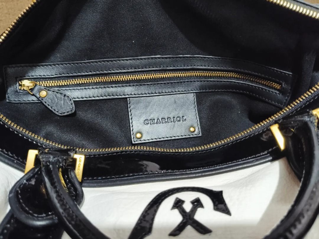 Original CHARIOL (Category: Luxury Bags & Wallets) located in Cabuyao City. Submitted by your____lux____shop (Listing ID 1458468152, Image 3). Description: Sale❗️Sale❗️Sale❗️ ₱ 5,880 Original CHARRIOL Almost new Black & white Ykk zipper Medium-Large Pure genuine leather No flaws 📌First to pay!.