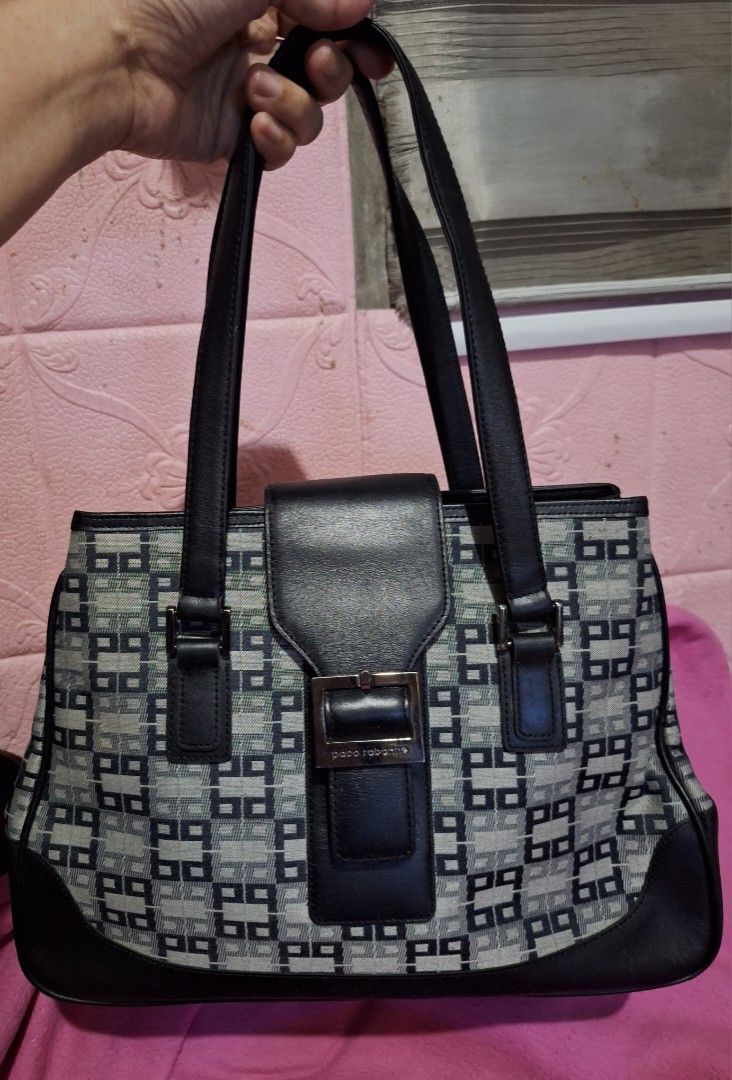 Paco Rabanne Monogram Tote Bag (Category: Luxury Bags & Wallets) located in Quezon City. Submitted by cloudymay (Listing ID 1452416108, Image 1). Description: - Paco Rabanne signature monogram pattern - Black leather trim and handles - Secure zip closure - Metal feet on the bottom - Interior zip pocket - Classic and versatile for everyday use.