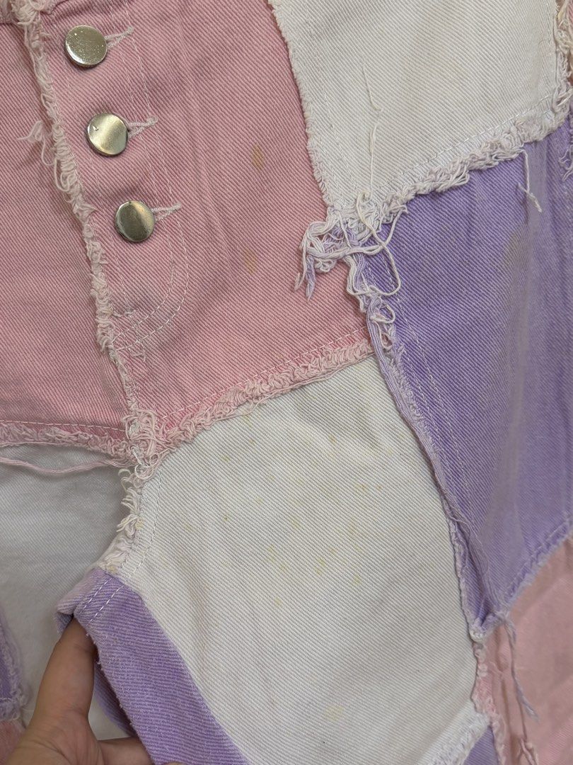 Patchwork Pink Purple White Denim Jeans (Category: Jeans) located in Navotas City. Submitted by yangi_2 (Listing ID 1458386927, Image 3). Description: 🌸💜 Patchwork Denim Jeans • Eye-catching patchwork design in pink, purple & white denim • Trendy frayed hem & distressed details • Button fly closure • Unique and colorful statement piece • Perfect for casual OOTDs and everyday wear • Waist: 15.5” (flat lay) • Length: 39” • Please see the photos f