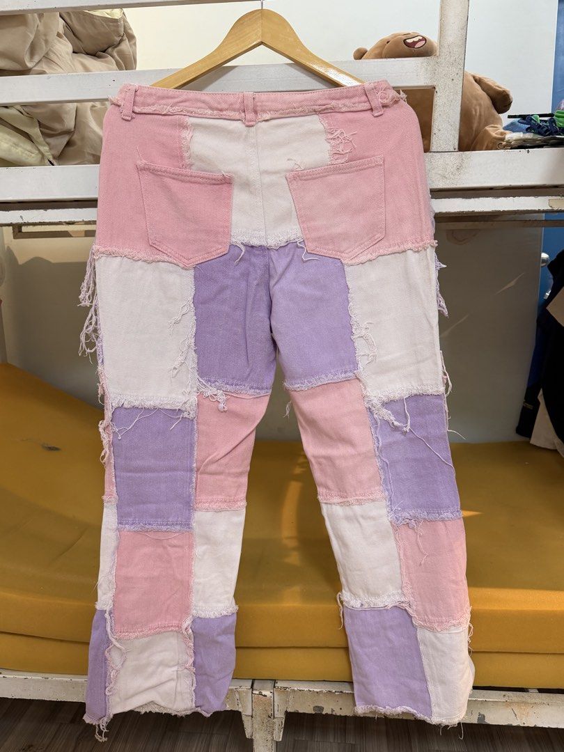 Patchwork Pink Purple White Denim Jeans (Category: Jeans) located in Navotas City. Submitted by yangi_2 (Listing ID 1458386927, Image 2). Description: 🌸💜 Patchwork Denim Jeans • Eye-catching patchwork design in pink, purple & white denim • Trendy frayed hem & distressed details • Button fly closure • Unique and colorful statement piece • Perfect for casual OOTDs and everyday wear • Waist: 15.5” (flat lay) • Length: 39” • Please see the photos f