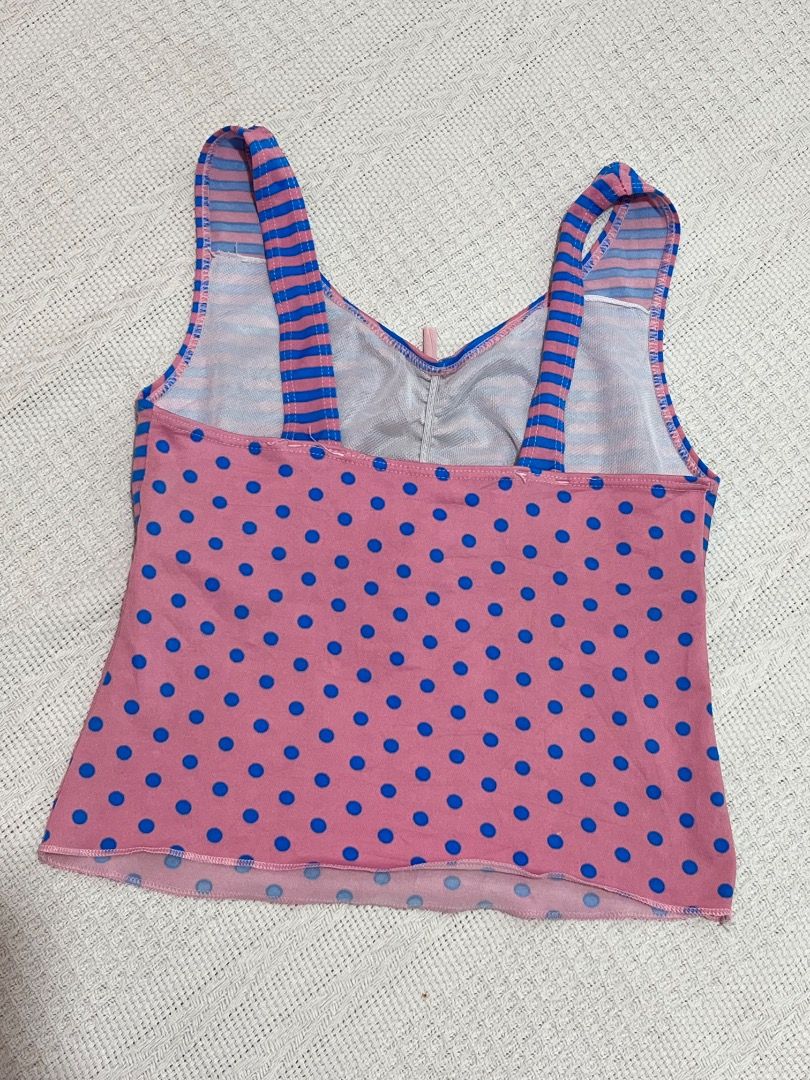 Pink Blue Striped Polka Dot Tank Top (Category: Sleeveless) located in Santa Rosa. Submitted by rsxyen (Listing ID 1458425073, Image 3). Description: - Adorable tank top with a unique pink and blue stripe pattern on top. - Features a charming pink bottom adorned with blue polka dots. - Stylish tie detail at the front for a cute accent. - Trendy strappy design for a fashionable look. - Versatile piece, ideal for casual outings or as a layering opt