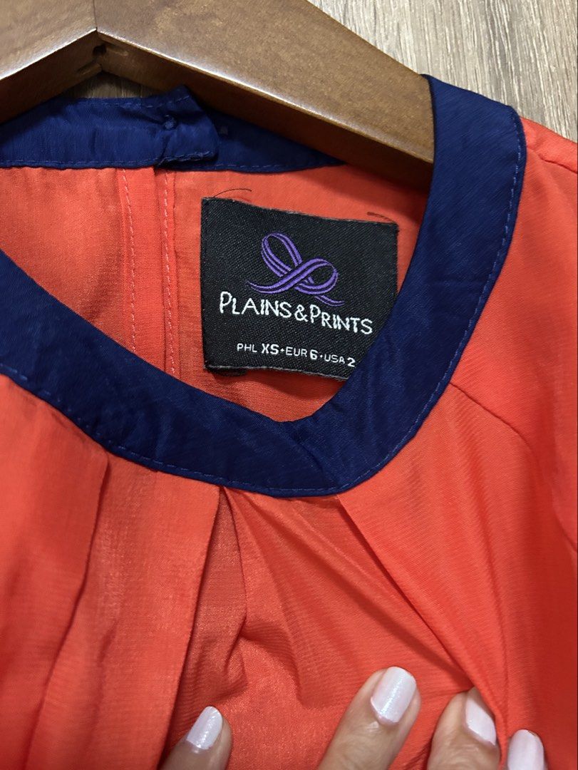 Plains & Prints Blouse (Category: Blouses) located in Bulacan. Submitted by relove.re (Listing ID 1458394925, Image 3). Description: - Plain blouse - Orange and Dark Blue color - Can fit XS or S - A bit close neck - Bottom Gaterized design .