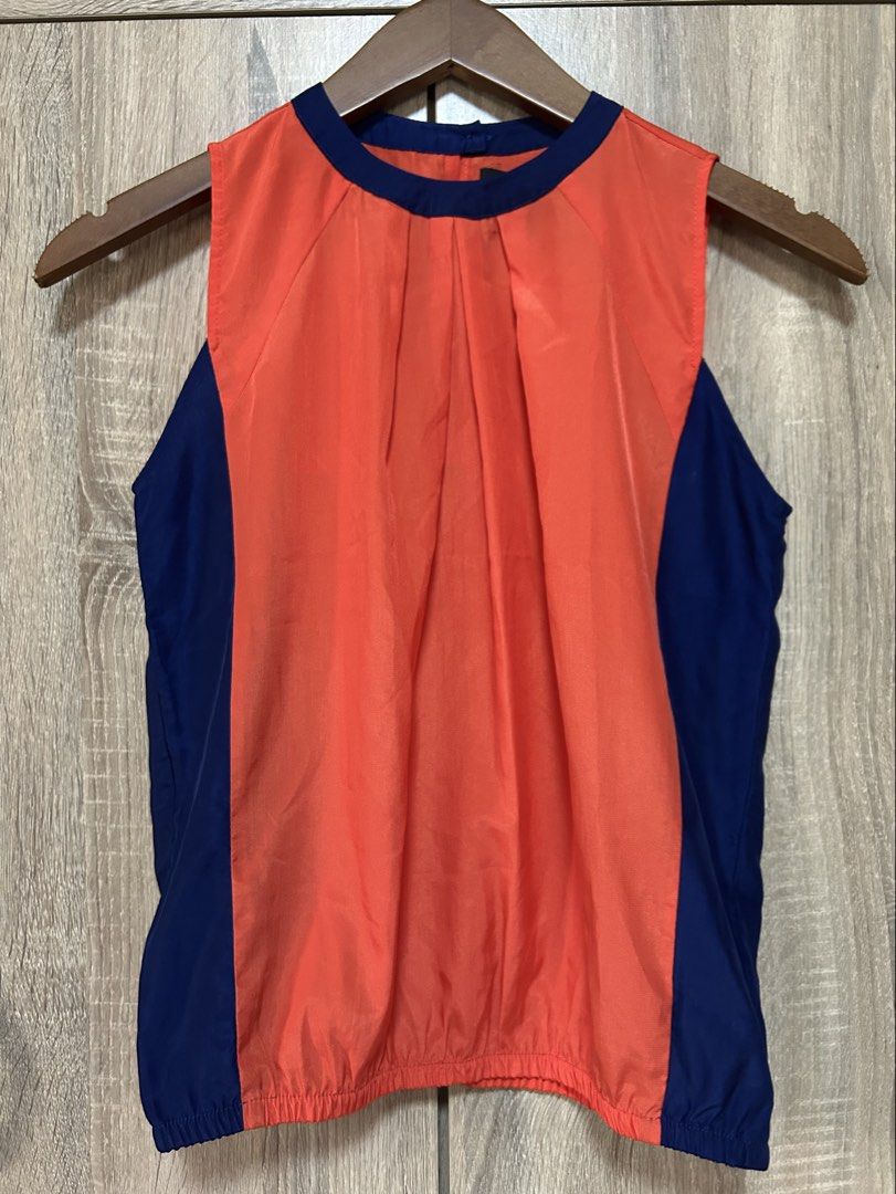 Plains & Prints Blouse (Category: Blouses) located in Bulacan. Submitted by relove.re (Listing ID 1458394925, Image 1). Description: - Plain blouse - Orange and Dark Blue color - Can fit XS or S - A bit close neck - Bottom Gaterized design .