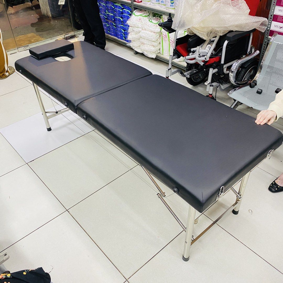 Portable Massage Table Black Face Cradle (Category: Massage Devices) located in Manila. Submitted by beniwise (Listing ID 1458376522, Image 1). Description: MASSAGE BED - Black portable massage table - Features a face cradle opening - Sturdy metal frame with cable support - Folds compactly for easy transport - Perfect for mobile therapists or home use - Minor scuffs on frame from storage.