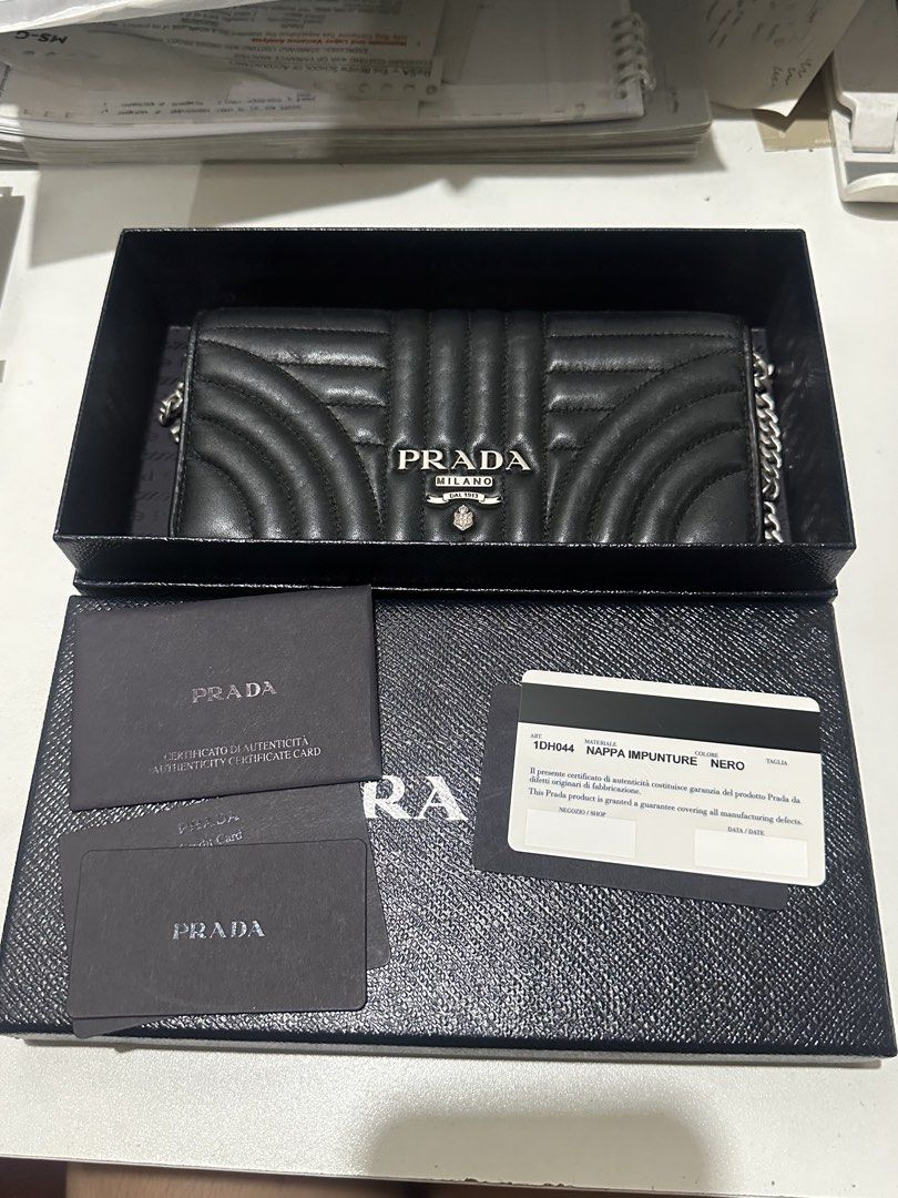 Prada Black Quilted Leather Wallet on Chain (Category: Luxury Bags & Wallets) located in Manila. Submitted by kyssmenot (Listing ID 1458441155, Image 3). Description: - Authentic Prada Wallet on Chain - Color: Black - Material: Quilted Leather - Hardware: Silver - Includes: Original Box, Authenticity Cards - Perfect for carrying essentials.