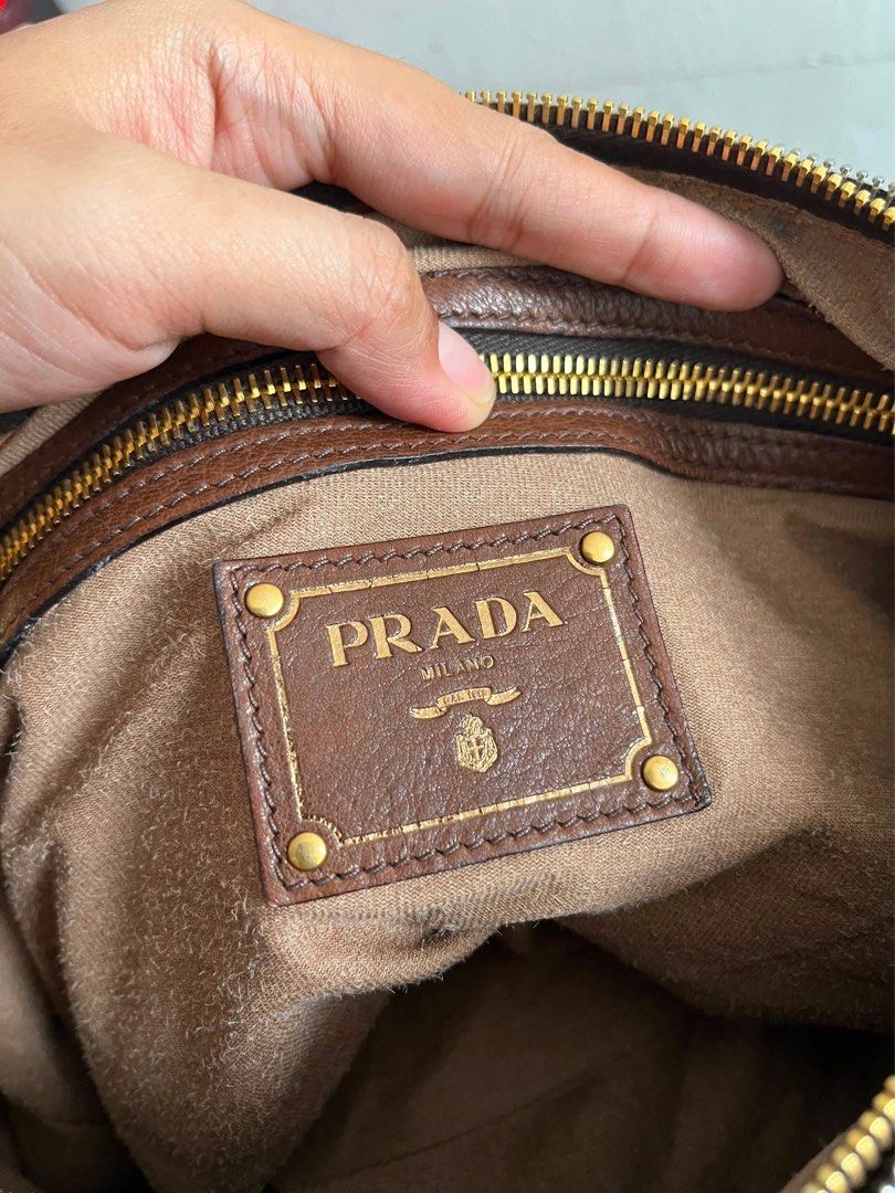 Prada Milano Brown Leather Chain Shoulder Bag (Category: Luxury Bags & Wallets) located in Sariaya. Submitted by luxecam (Listing ID 1458380332, Image 2). Description: - Authentic Prada Bag - Made in Italy - Rich Brown Pebbled Leather - Elegant Gold Chain Detail - Spacious Interior with Multiple Compartments - Smooth Zipper Action - Comes with Original Dust Bag - Ideal Everyday Bag.