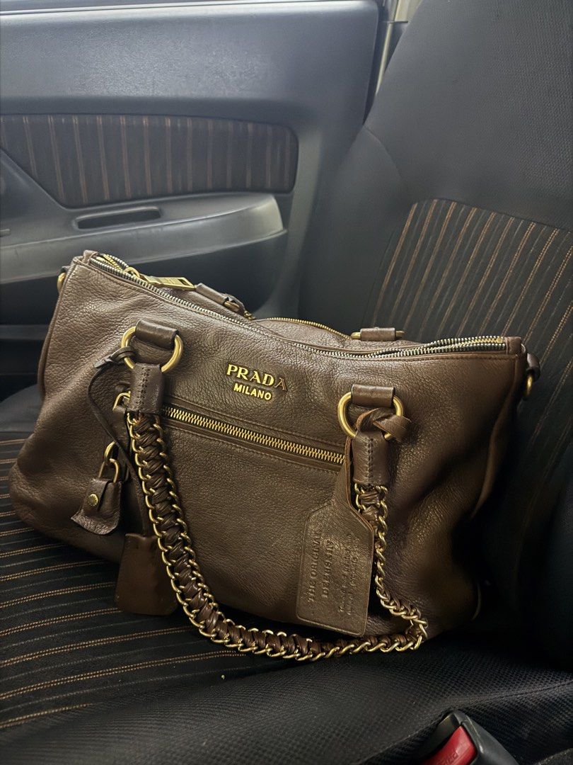 Prada Milano Brown Leather Chain Shoulder Bag (Category: Luxury Bags & Wallets) located in Sariaya. Submitted by luxecam (Listing ID 1458380332, Image 1). Description: - Authentic Prada Bag - Made in Italy - Rich Brown Pebbled Leather - Elegant Gold Chain Detail - Spacious Interior with Multiple Compartments - Smooth Zipper Action - Comes with Original Dust Bag - Ideal Everyday Bag.
