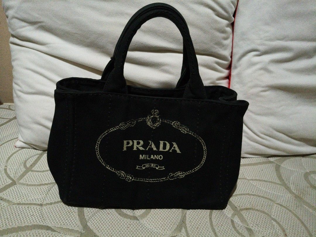 Prada Small Black Canapa (Category: Luxury Bags & Wallets) located in Quezon City. Submitted by online_sari_sari (Listing ID 1458440113, Image 1). Description: 💯 authentic slightly negotiable.