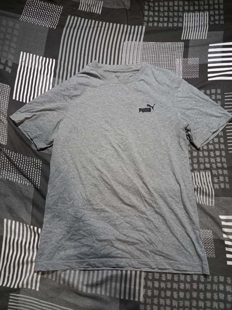 Puma Grey T-Shirt Men's Size L (Category: Tshirts & Polo Shirts ) located in Panabo. Submitted by khimmyirish_ki021126 (Listing ID 1458360693, Image 2). Description: - Classic grey Puma t-shirt - Features the iconic Puma logo on the chest - Made in Bangladesh - Measurements: Pit to pit approx. 21 inches, Length approx. 29 inches - Ideal for everyday casual wear.