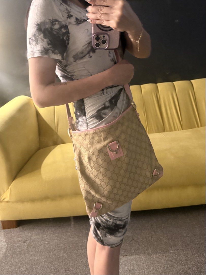 RARE Pink Gucci crossbody (Category: Luxury Bags & Wallets) located in Davao. Submitted by katemiddletown (Listing ID 1458452720, Image 2). Description: RARE pink Gucci crossbody Flaws: corner rubs, inner pocket zipper needs repair, interior stain (shown in the photos), hardware plating with scratches And exterior condition is still good Great leather condition Stitchings intact Main zipper is very smooth, excellent condition Strap is very solid,