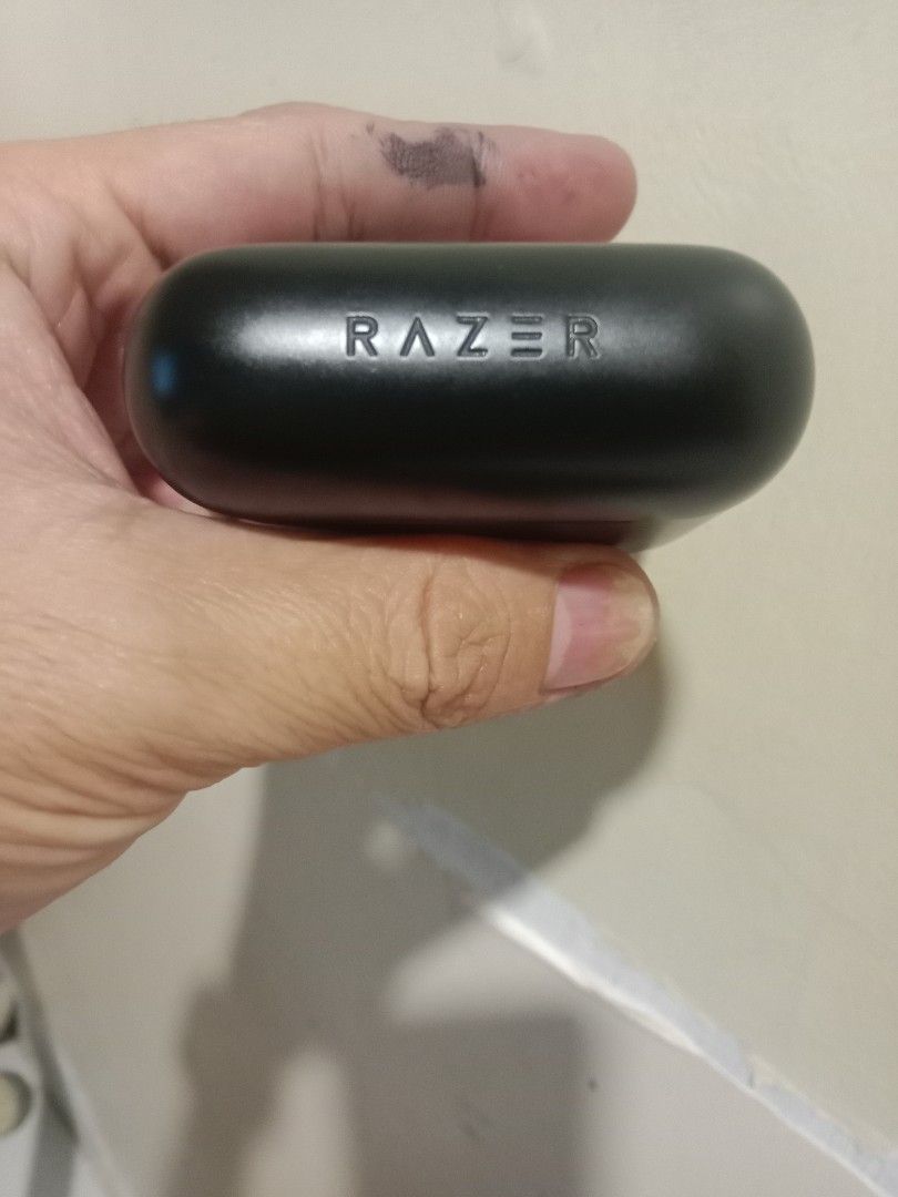 Razer Wireless Earbuds with Charging Case (Category: Earphones) located in Makati City. Submitted by speedy1990 (Listing ID 1458308932, Image 1). Description: - Authentic Razer wireless earbuds in sleek black. - Iconic green glowing Razer logo on each earbud. - Includes compact charging case with indicator light. - Perfect for immersive gaming sessions. - Ideal for everyday listening and calls..