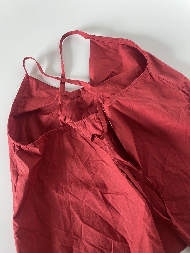 Red Bow Camisole Top with Tie Back (Category: Sleeveless) located in Cavite. Submitted by devilourea (Listing ID 1458334532, Image 2). Description: - Adorable red camisole top - Features a prominent bow detail at the front - Adjustable spaghetti straps for comfort - Back ties for a customizable fit - Versatile: pairs well with jeans or skirts - Ideal for nights out or casual wear.