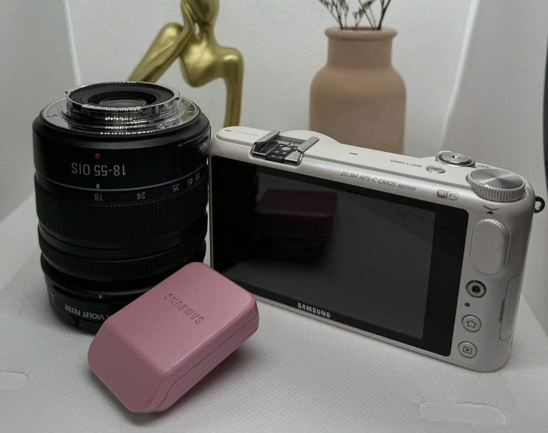 Samsung NX2000 Mirrorless Camera (Category: Cameras) located in Iba. Submitted by kamira.ni.rosi (Listing ID 1458433867, Image 2). Description: Lightly used Samsung NX2000 Mirrorless Camera. No issues, gagamitin nalang. Can ship anywhere, but SF will be shouldered by the buyer. Price is slightly negotiable Inclusions: - Samsung NX2000 body - Samsung 18-55mm kit lens (black) - Samsung SEF8A flash (pink) - Jessops Ultra Violet Filter - Battery x1 -