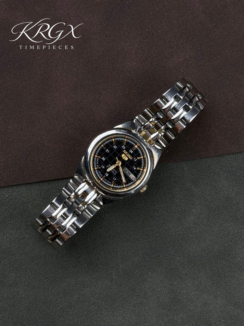 Seiko 5 Automatic Day Date Black Dial Watch (Category: Women's Watches) located in Manila. Submitted by kevin_leal15 (Listing ID 1458465395, Image 1). Description: Seiko 5 Ladies "Military" A striking Seiko automatic with a sophisticated black dial, refined gold accents, and a classic stainless-steel finish.🖤⌚ ✔️ Movement: 4207 Automatic ✔️ Case Size: Approx. 25mm ✔️Approx. 6.5 inch wrist size ✔️ All original ✔️ Newly serviced ✔️ Newly polished 