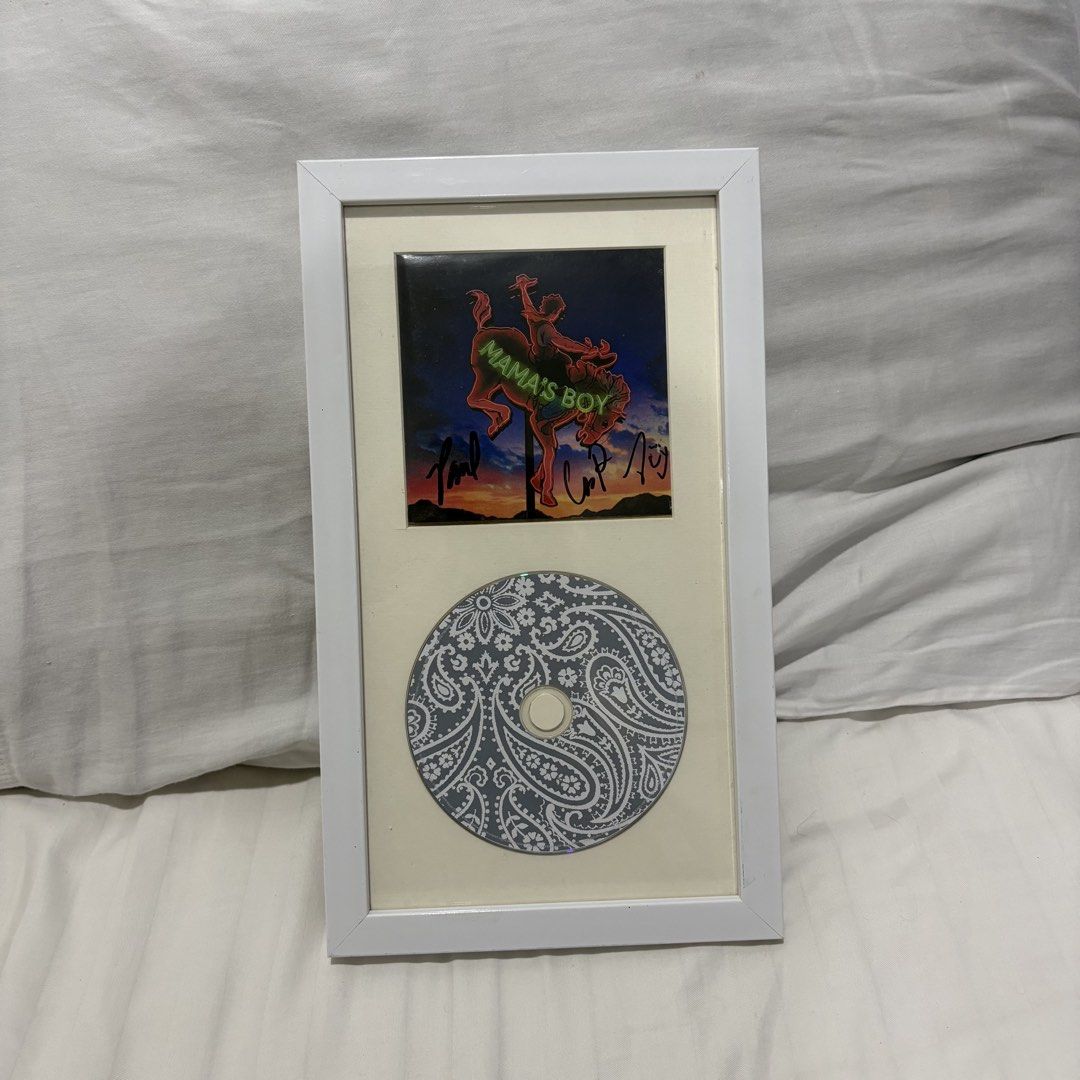 Signed Lany Mama's Boy Album CD Framed (Category: CDs & DVDs) located in Calamba. Submitted by bolonks_ (Listing ID 1458377765, Image 1). Description: - Framed artwork from the Lany 'Mama's Boy' album. - Features signed album art. - Includes a CD .