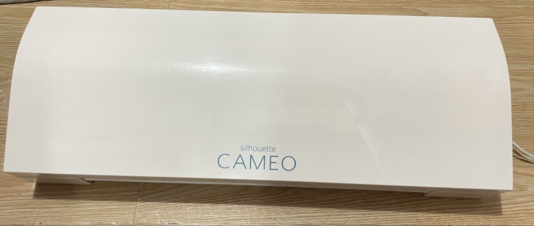 Silhouette CAMEO Cutter plotter (Category: Printers, Scanners & Copiers) located in Manila. Submitted by artypaper_25 (Listing ID 1458337263, Image 3). Description: RFS: Hindi na nagagamit kasi may isa pang cutterplotter. Ginagamit lang sya pang cut ng vinyl stickers para sa mirror ng client ko. With box kaso may punit ang box nya sa katagalan natambak No inclusions. 📍San miguel pasig city.