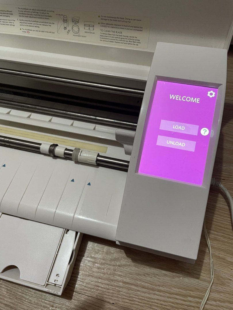 Silhouette CAMEO Cutter plotter (Category: Printers, Scanners & Copiers) located in Manila. Submitted by artypaper_25 (Listing ID 1458337263, Image 2). Description: RFS: Hindi na nagagamit kasi may isa pang cutterplotter. Ginagamit lang sya pang cut ng vinyl stickers para sa mirror ng client ko. With box kaso may punit ang box nya sa katagalan natambak No inclusions. 📍San miguel pasig city.