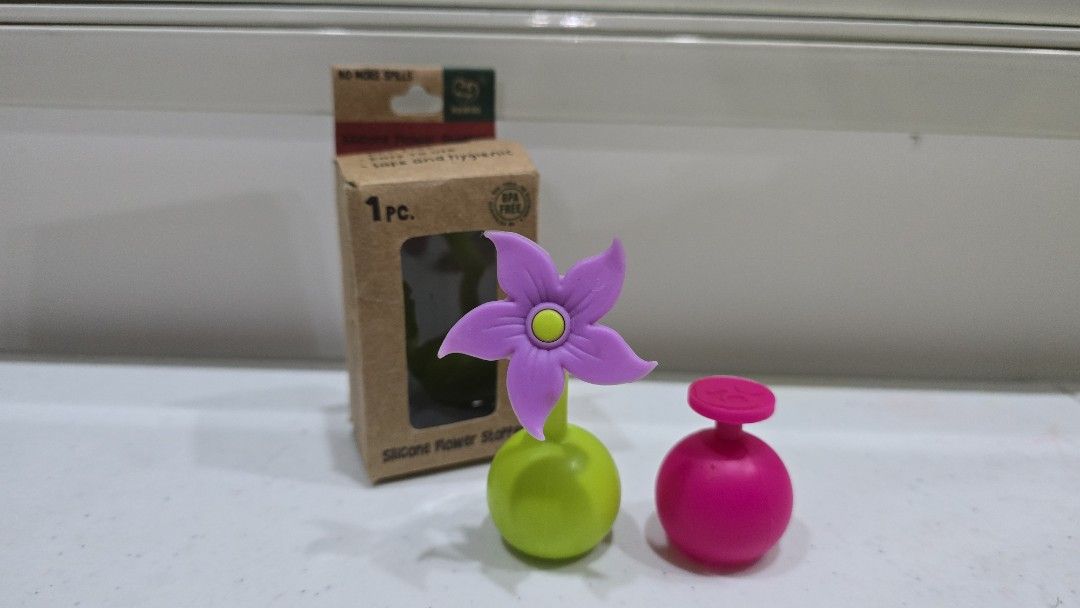 Silicone Flower Stopper - BPA Free (Category: Sanitary Hygiene) located in Naga. Submitted by flynm (Listing ID 1458318085, Image 1). Description: - Set of 2 silicone stoppers -haaka silicone flower stopper and nature bond - BPA-free and food-safe - Designed to prevent spills - Includes: 1 haaka silicone flower stopper, 1 naturebond pink stopper - Comes in original packaging (haaka) - used once .