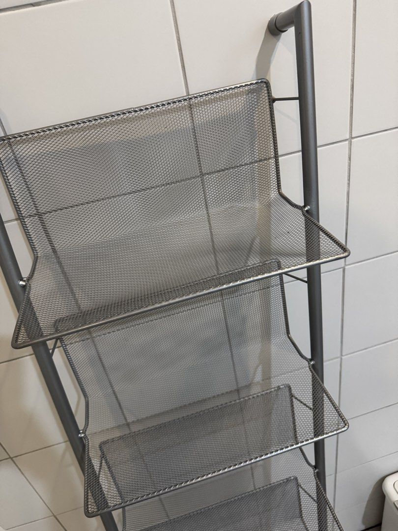 Silver Mesh 7-Tier Ladder Shelf Rack Organizer (Category: Shelves, Cabinets & Racks) located in Quezon City. Submitted by heylouise (Listing ID 1458420849, Image 3). Description: - Tall and slim silver mesh shelf rack - 7 tiers for ample storage - Ideal for organizing shoes, books, or display items - Mesh design ensures good ventilation - Space-saving design fits well in tight spaces - Perfect for bathrooms, closets, or entryways.