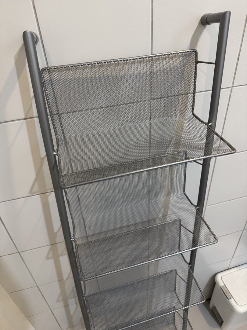 Silver Mesh 7-Tier Ladder Shelf Rack Organizer (Category: Shelves, Cabinets & Racks) located in Quezon City. Submitted by heylouise (Listing ID 1458420849, Image 2). Description: - Tall and slim silver mesh shelf rack - 7 tiers for ample storage - Ideal for organizing shoes, books, or display items - Mesh design ensures good ventilation - Space-saving design fits well in tight spaces - Perfect for bathrooms, closets, or entryways.