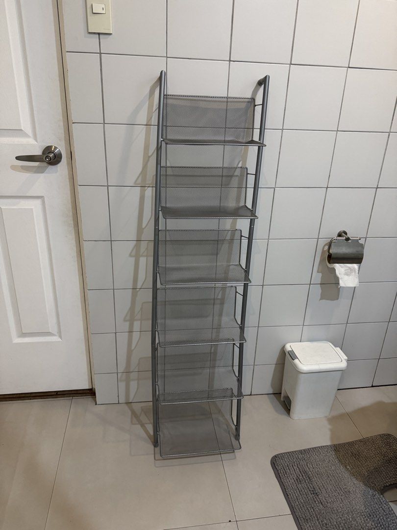 Silver Mesh 7-Tier Ladder Shelf Rack Organizer (Category: Shelves, Cabinets & Racks) located in Quezon City. Submitted by heylouise (Listing ID 1458420849, Image 1). Description: - Tall and slim silver mesh shelf rack - 7 tiers for ample storage - Ideal for organizing shoes, books, or display items - Mesh design ensures good ventilation - Space-saving design fits well in tight spaces - Perfect for bathrooms, closets, or entryways.